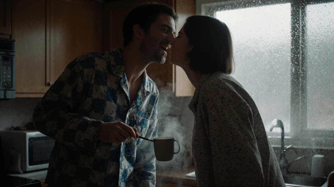 Two people laughing in a kitchen at night, one holding a screwdriver, about to share a spontaneous kiss.